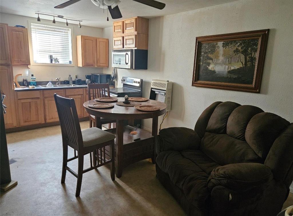 1347 Farm Road 38 Brookston, TX 75421 - Photo 6 of 7 a dining room with furniture and window