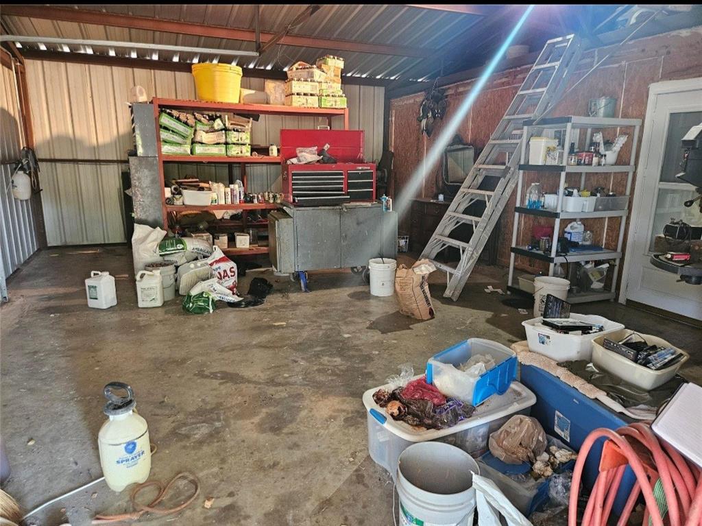 1347 Farm Road 38 Brookston, TX 75421 - Photo 7 of 7 a room with lots of bottles and chairs