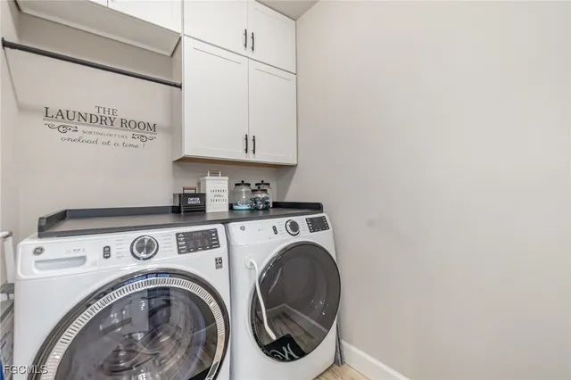a utility room with dryer and washer