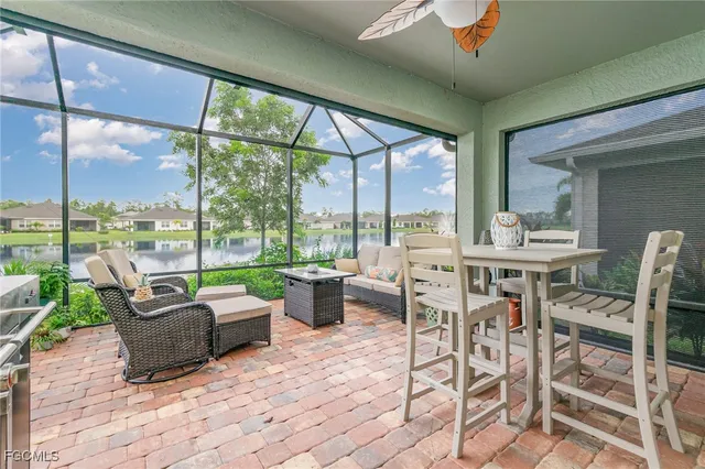 a building outdoor space with patio furniture and garden view