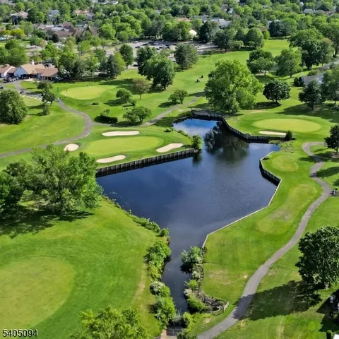an aerial view of a golf course with a garden