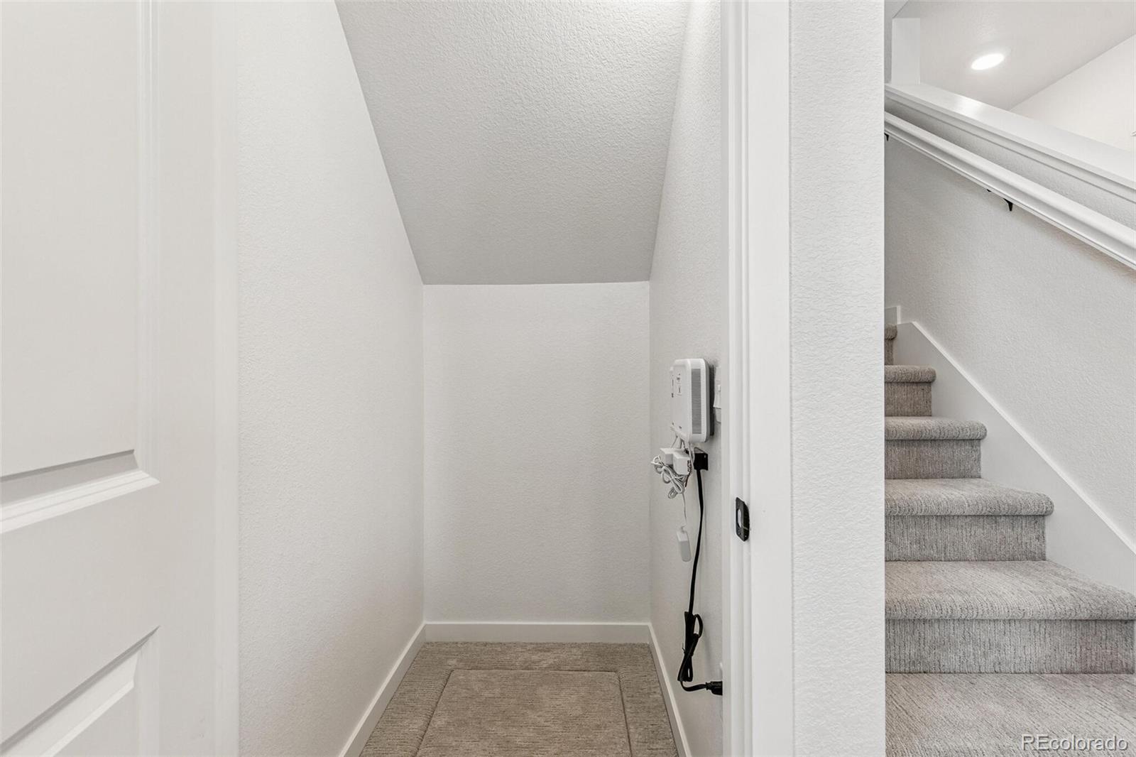 1374 South Chester Street, Unit A Denver, CO 80247 - Photo 20 of 35 a view of hallway with stairs and a shower