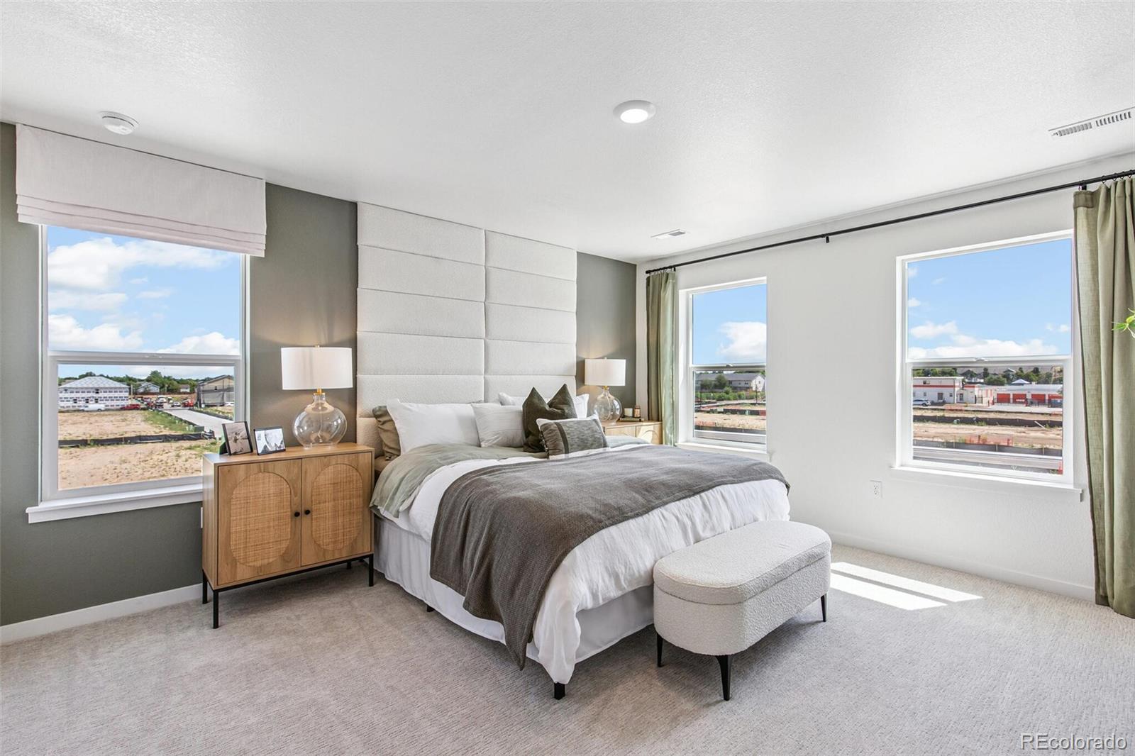 1374 South Chester Street, Unit A Denver, CO 80247 - Photo 22 of 35 a spacious bedroom with a bed and a window