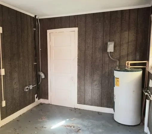a view of a storage & utility room with wooden walls