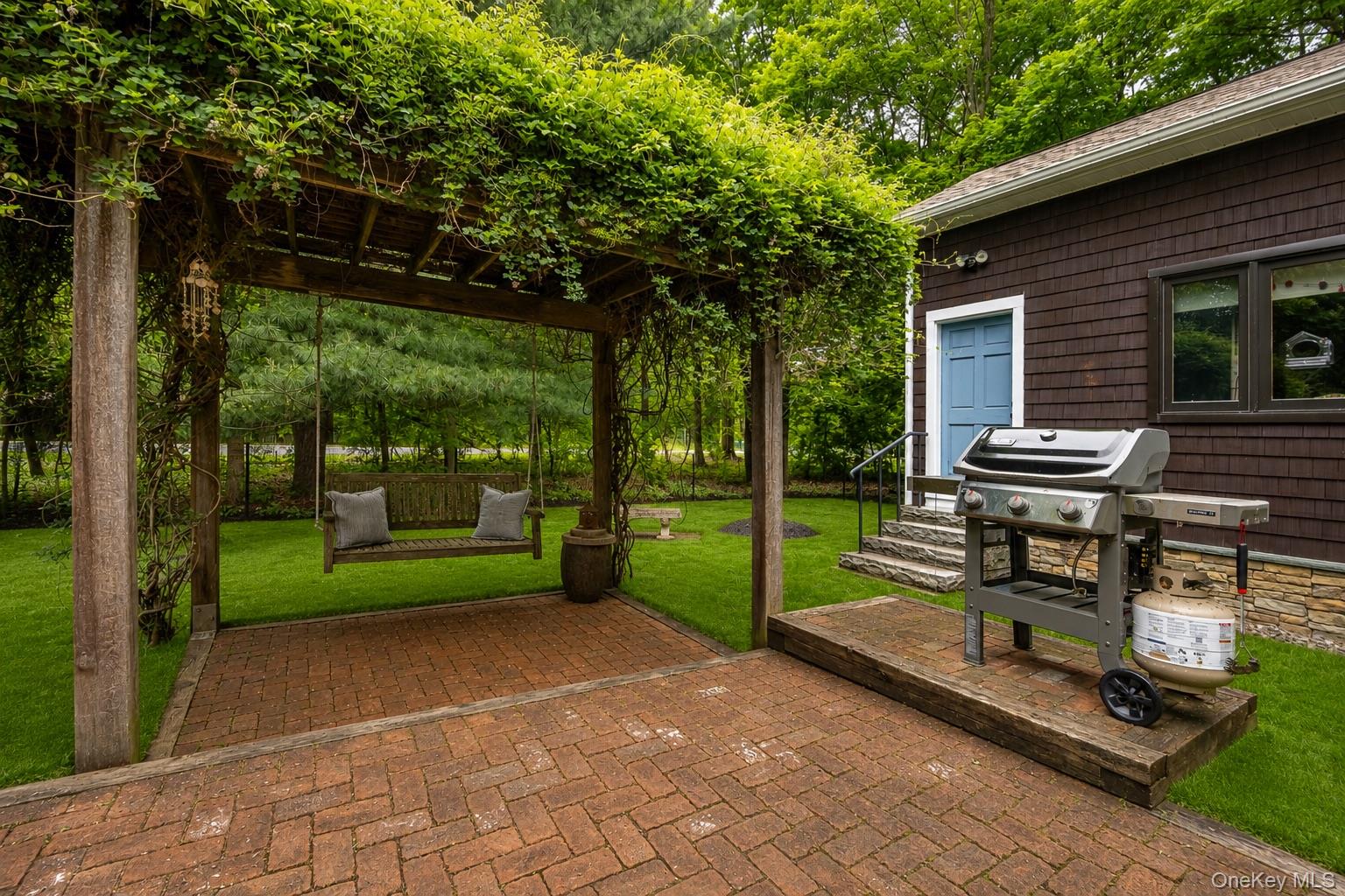 4 Clove Branch Road Hopewell Junction, NY 12533 - Photo 24 of 32 a view of a bench in the backyard of a house