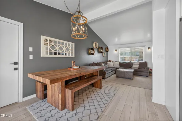 a view of a room with furniture and rug