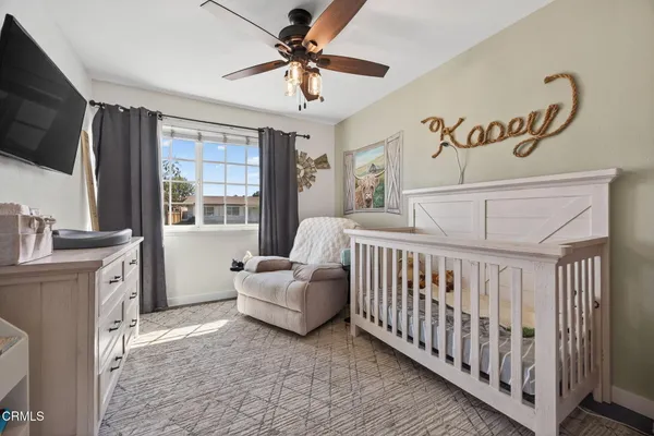a bedroom with furniture and a window