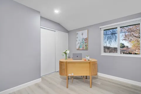 a workspace with furniture and window