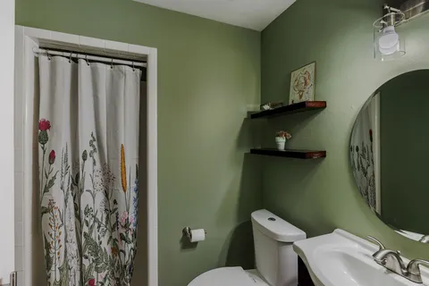 a bathroom with a toilet and a sink