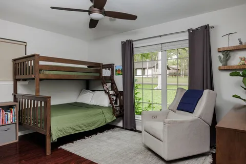 a bedroom with a bed and a couch