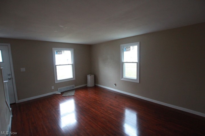 3606 Shelby Road Youngstown, OH 44511 - Photo 7 of 33 Spare room with dark wood-type flooring and plenty of natural light