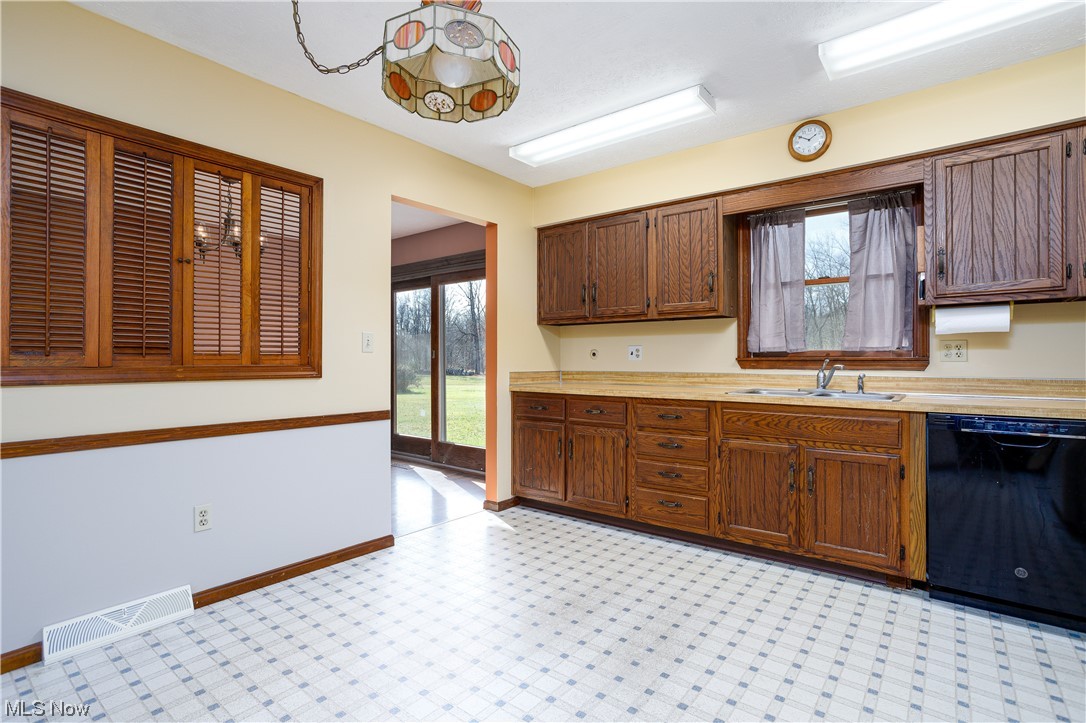 5680 Lance Road Medina, OH 44256 - Photo 16 of 32 Kitchen featuring light tile flooring, dishwasher, and sink