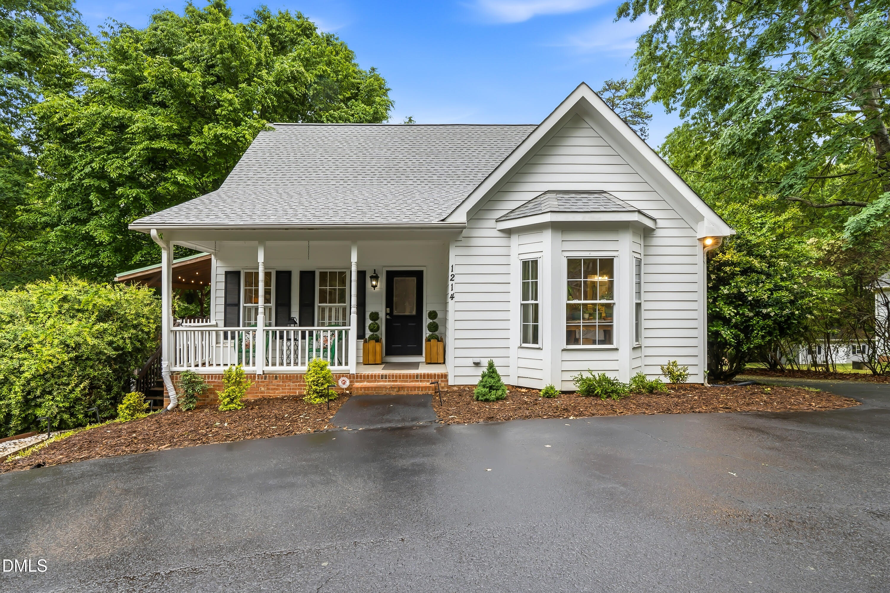 1214 Halcyon Place Rougemont, NC 27572 - Photo 2 of 69 a front view of a house with a yard and garage