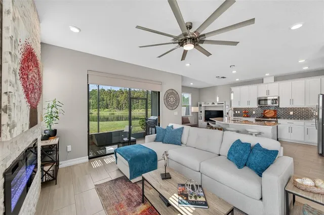 a living room with kitchen island furniture and a wooden floor