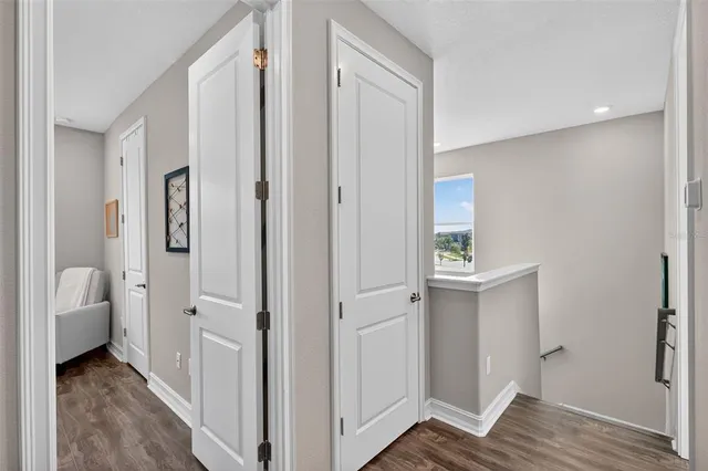 a view of a balcony with furniture and a potted plant