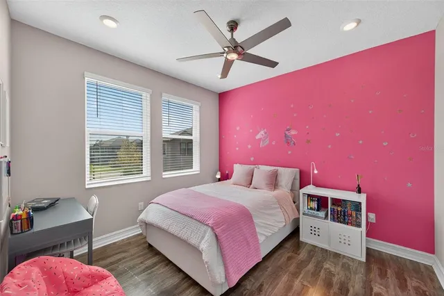 a spacious bathroom with a granite countertop sink and a mirror