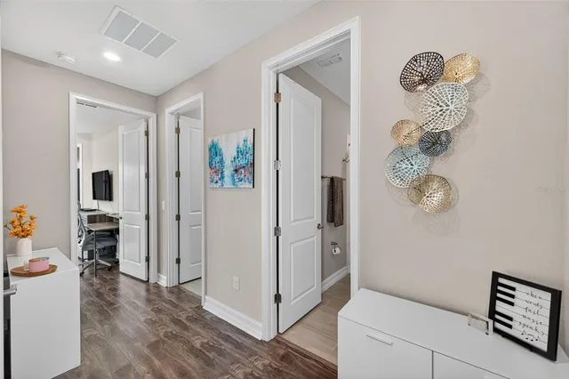a spacious bathroom with a granite countertop sink and a mirror