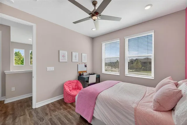 a view of walk in closet with clothes