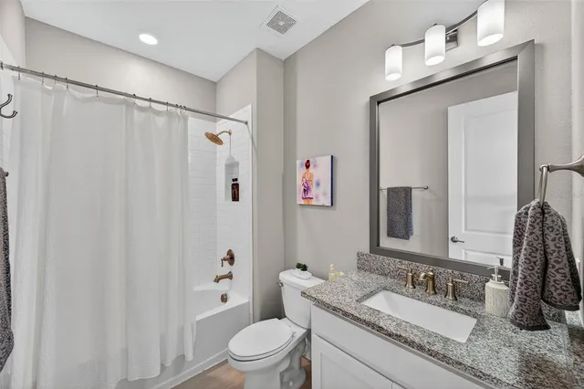 a view of a house with a yard and plants