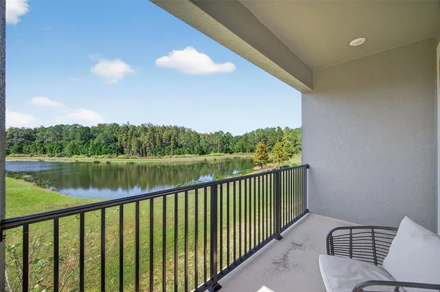 a view of a swimming pool with a patio and a yard