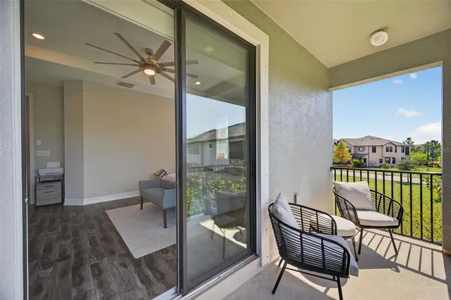 a view of a swimming pool with a patio and a yard