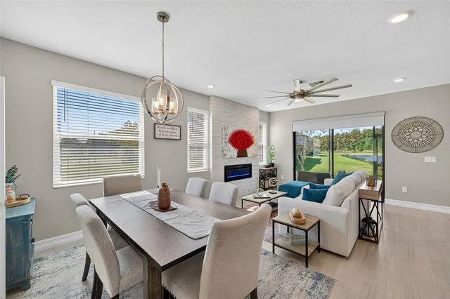 a living room with lots of furniture and wooden floor