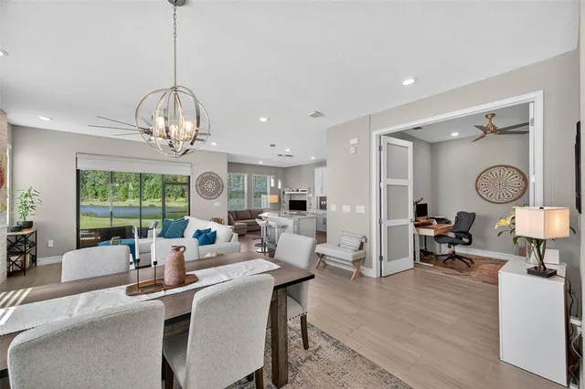 a living room with lots of furniture and wooden floor