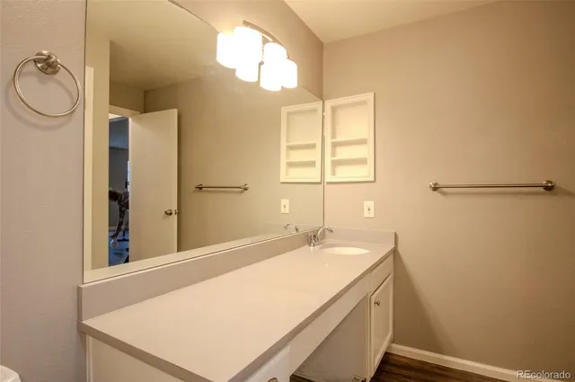 a bathroom with a sink and a mirror