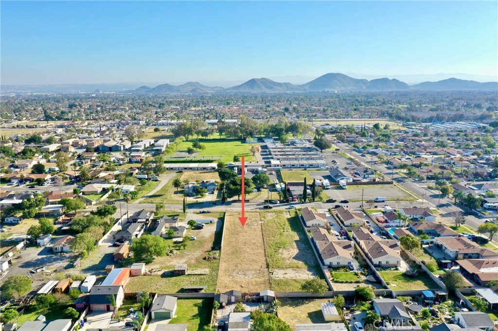 17562 Court Street Fontana, CA 92336 - Photo 13 of 16 an aerial view of residential houses with outdoor space and swimming pool