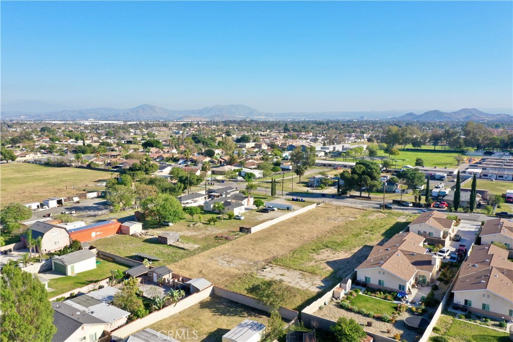 17562 Court Street Fontana, CA 92336 - Photo 7 of 16 an aerial view of residential houses with outdoor space