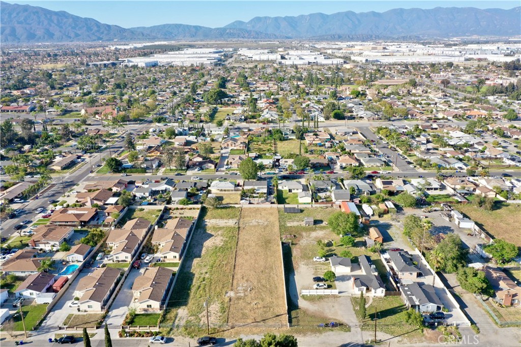 17562 Court Street Fontana, CA 92336 - Photo 10 of 16 an aerial view of residential building and car parked