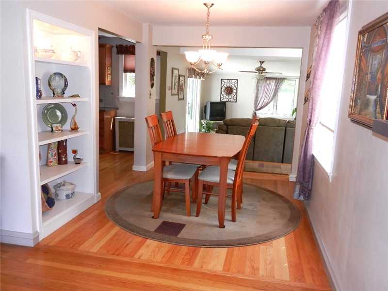 60 Audubon Road Warwick, RI 02888 - Photo 5 of 25 Dining Room. Hardwood floors connect Living Room, Dining Room and Kitchen; highlighting the "open airy" feeling you experience moving through the living area of the home!!!