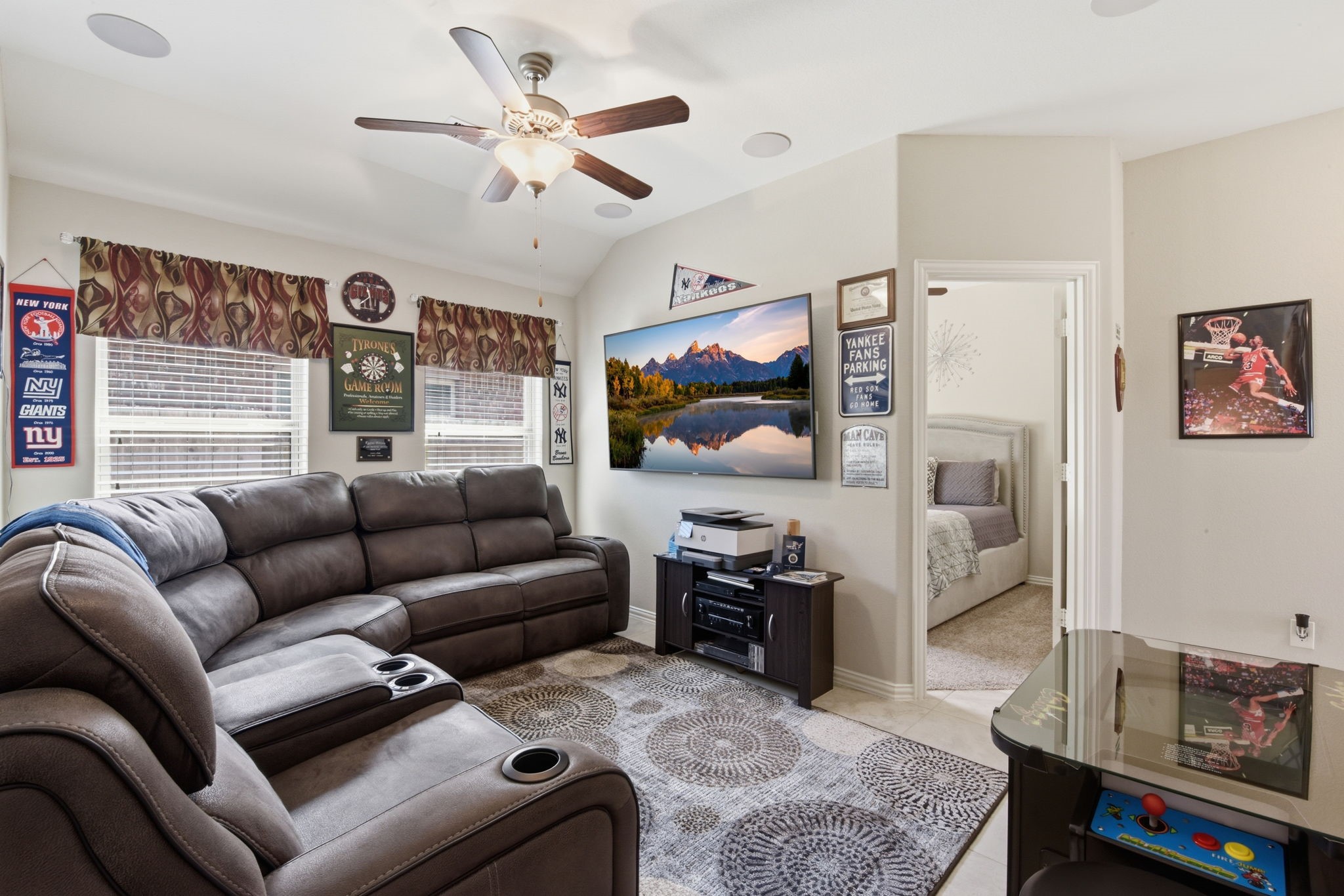 3811 Oakmist Bend Lane Spring, TX 77386 - Photo 11 of 23 a living room with furniture a ceiling fan and a window