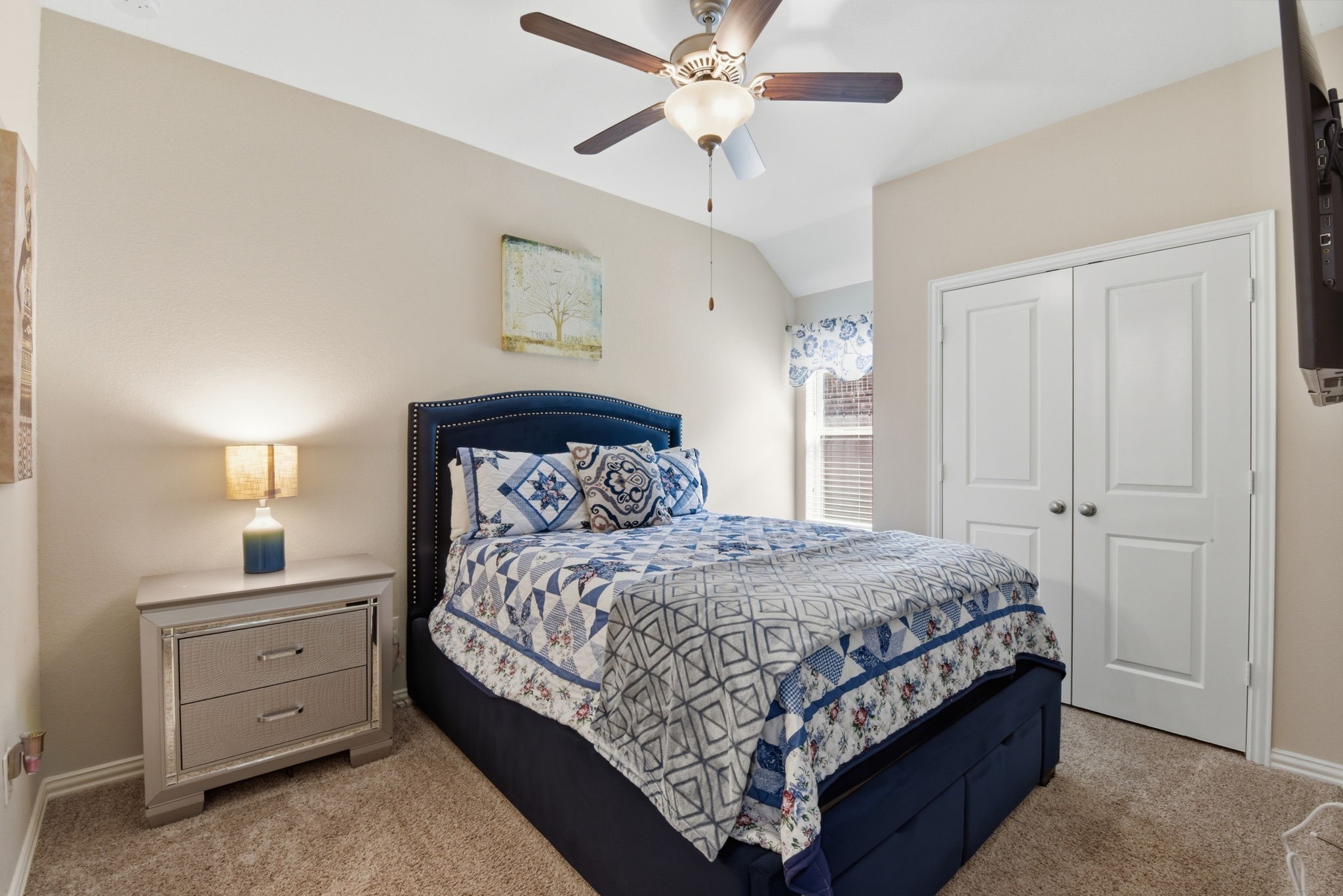 3811 Oakmist Bend Lane Spring, TX 77386 - Photo 12 of 23 a bedroom with a bed and a chandelier