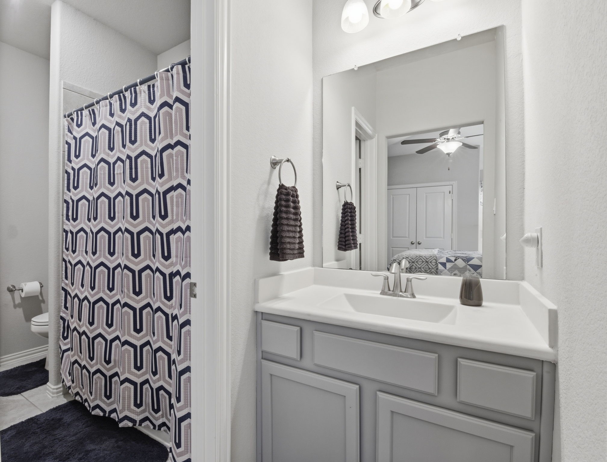 3811 Oakmist Bend Lane Spring, TX 77386 - Photo 13 of 23 a bathroom with a sink and a mirror