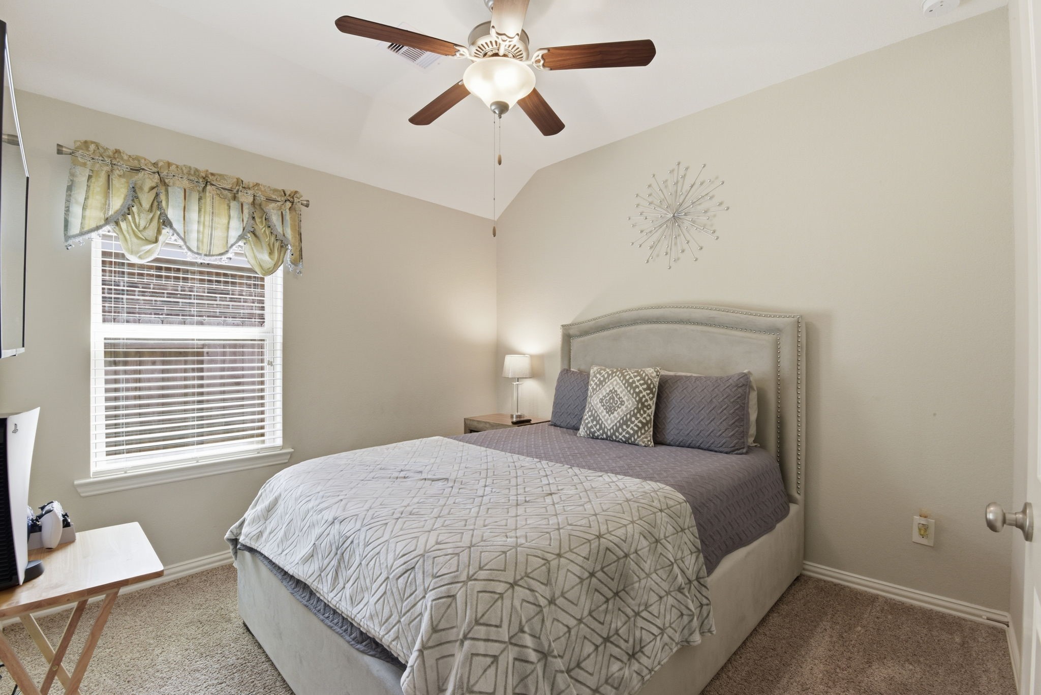 3811 Oakmist Bend Lane Spring, TX 77386 - Photo 14 of 23 a bedroom with a large bed and a chandelier fan