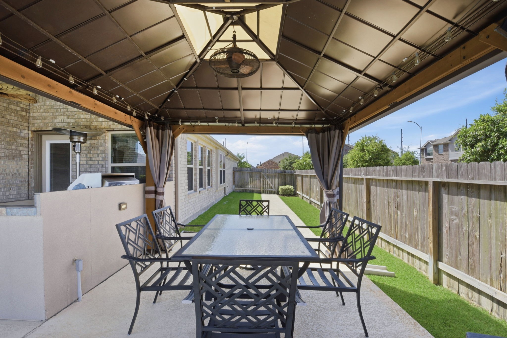 3811 Oakmist Bend Lane Spring, TX 77386 - Photo 17 of 23 a view of a patio with a table and chairs