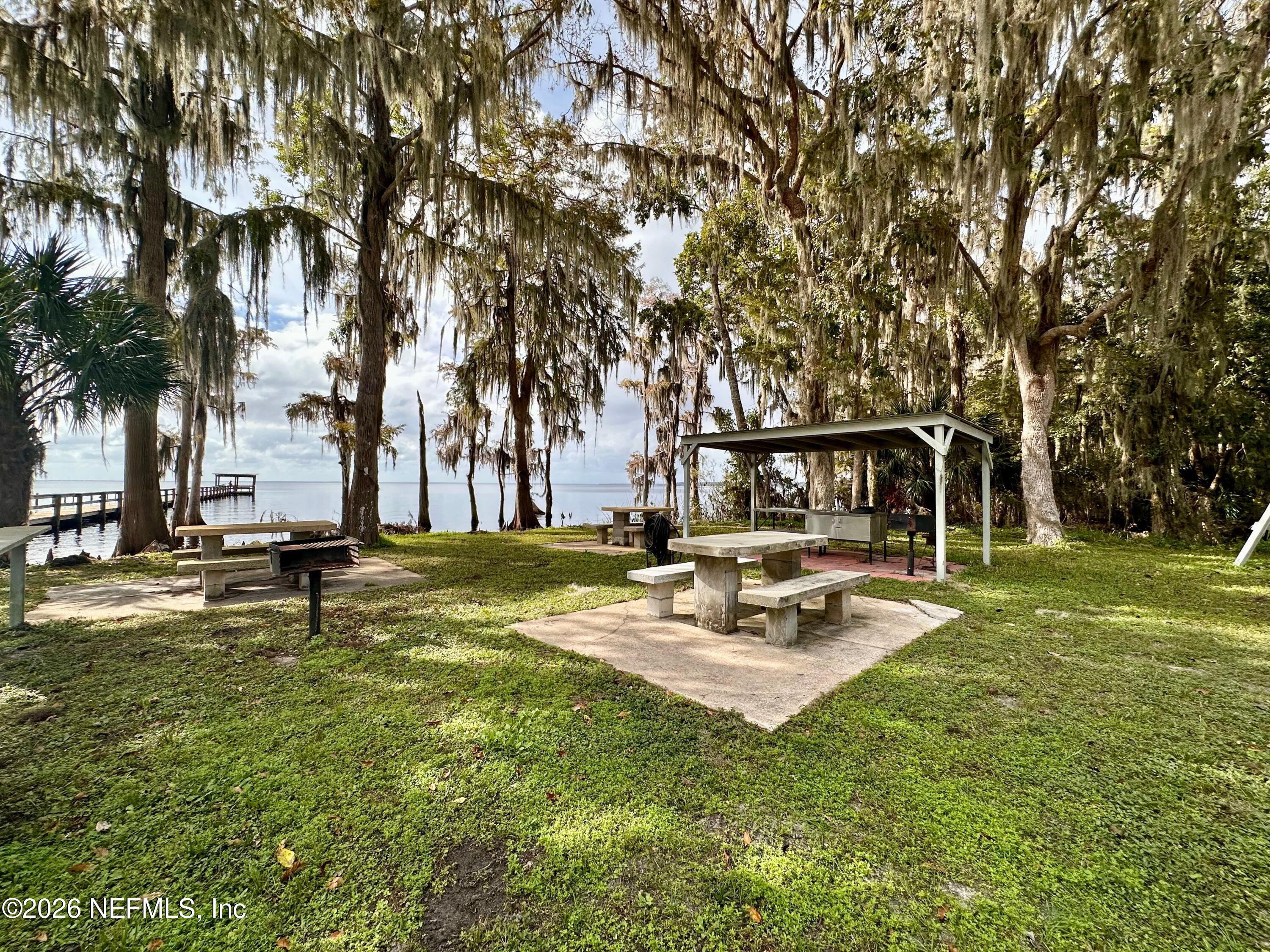 233 Marie Avenue Georgetown, FL 32139 - Photo 12 of 15 a view of a house with swimming pool and sitting area