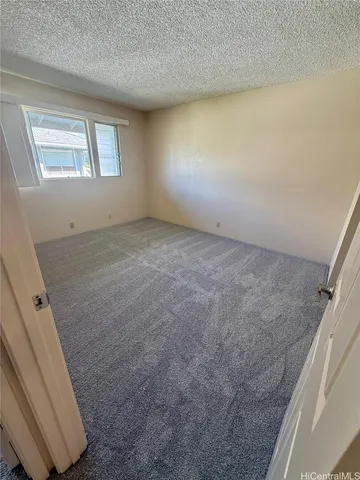 a view of an empty room with windows