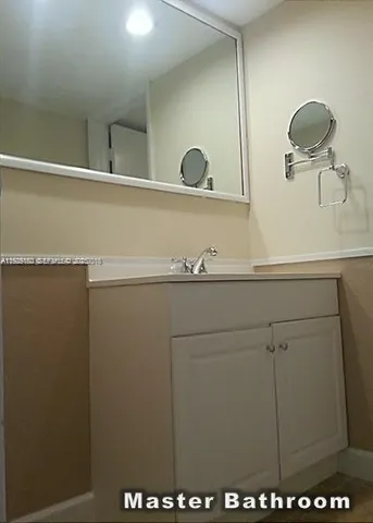 a bathroom with a toilet and a bath tub