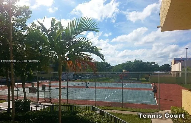 a view of staircase with railing and white walls