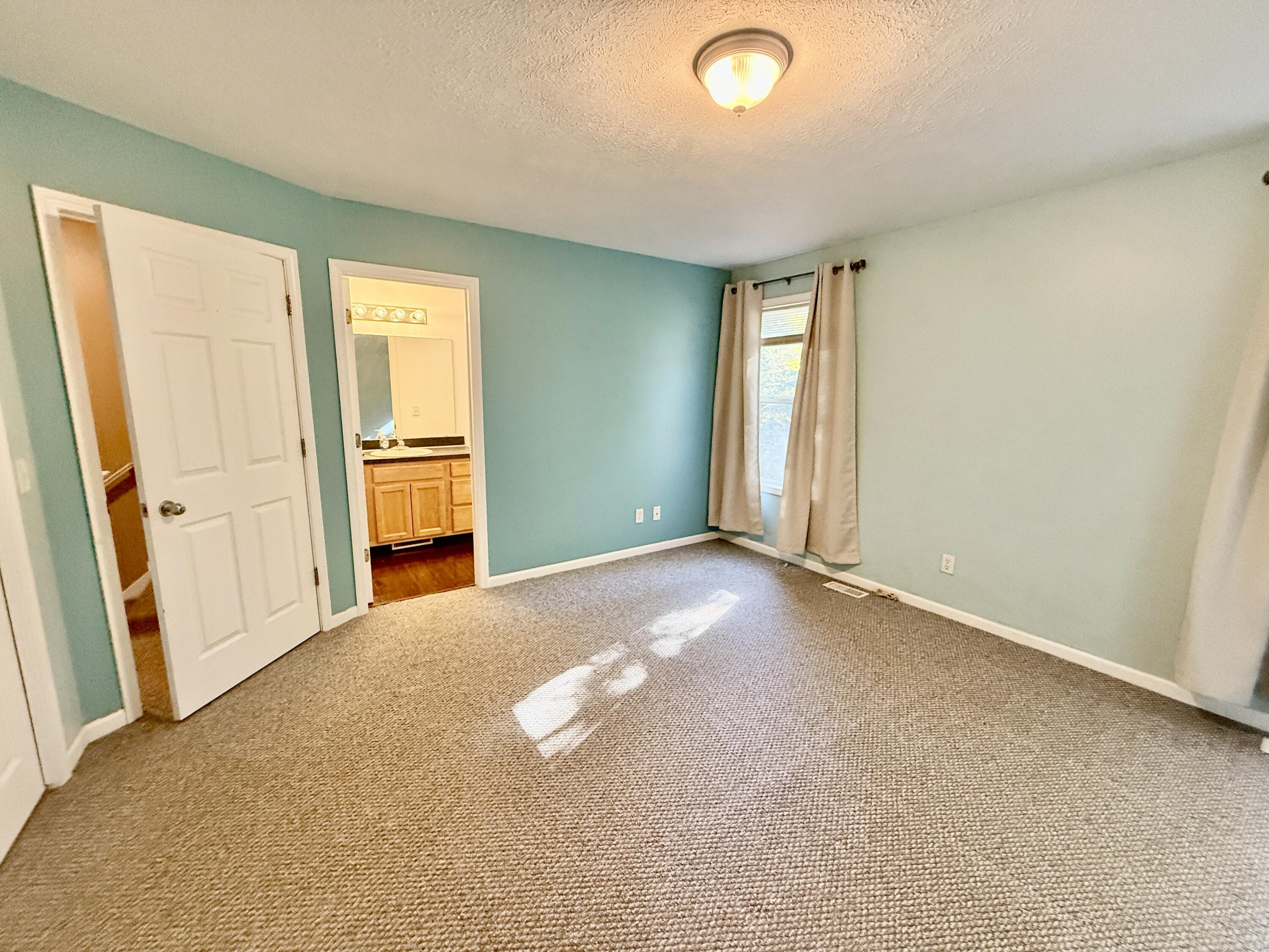 303 Wiley Road, Unit 10 Douglas, MI 49408 - Photo 16 of 43 Primary Bedroom Ensuite bath