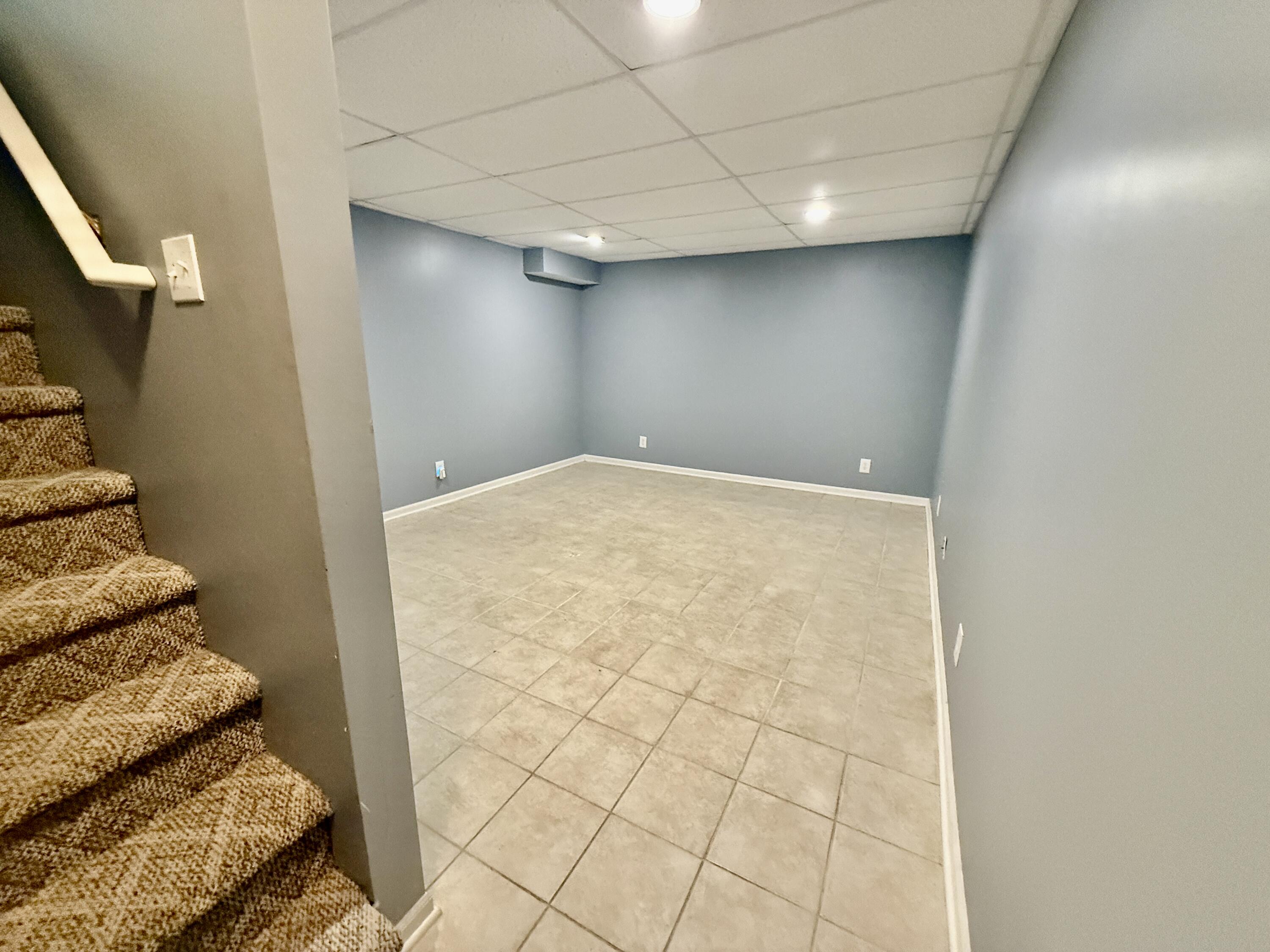 303 Wiley Road, Unit 10 Douglas, MI 49408 - Photo 25 of 43 Down to the finished lower level