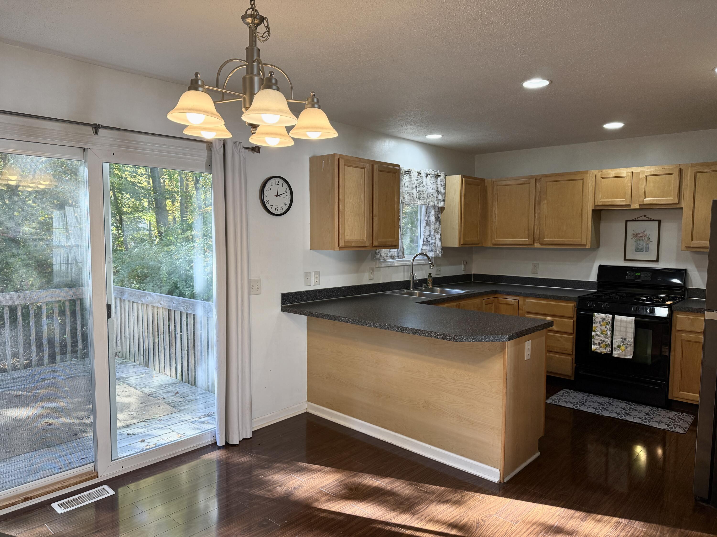 303 Wiley Road, Unit 10 Douglas, MI 49408 - Photo 6 of 43 Dining area opens to the deck
