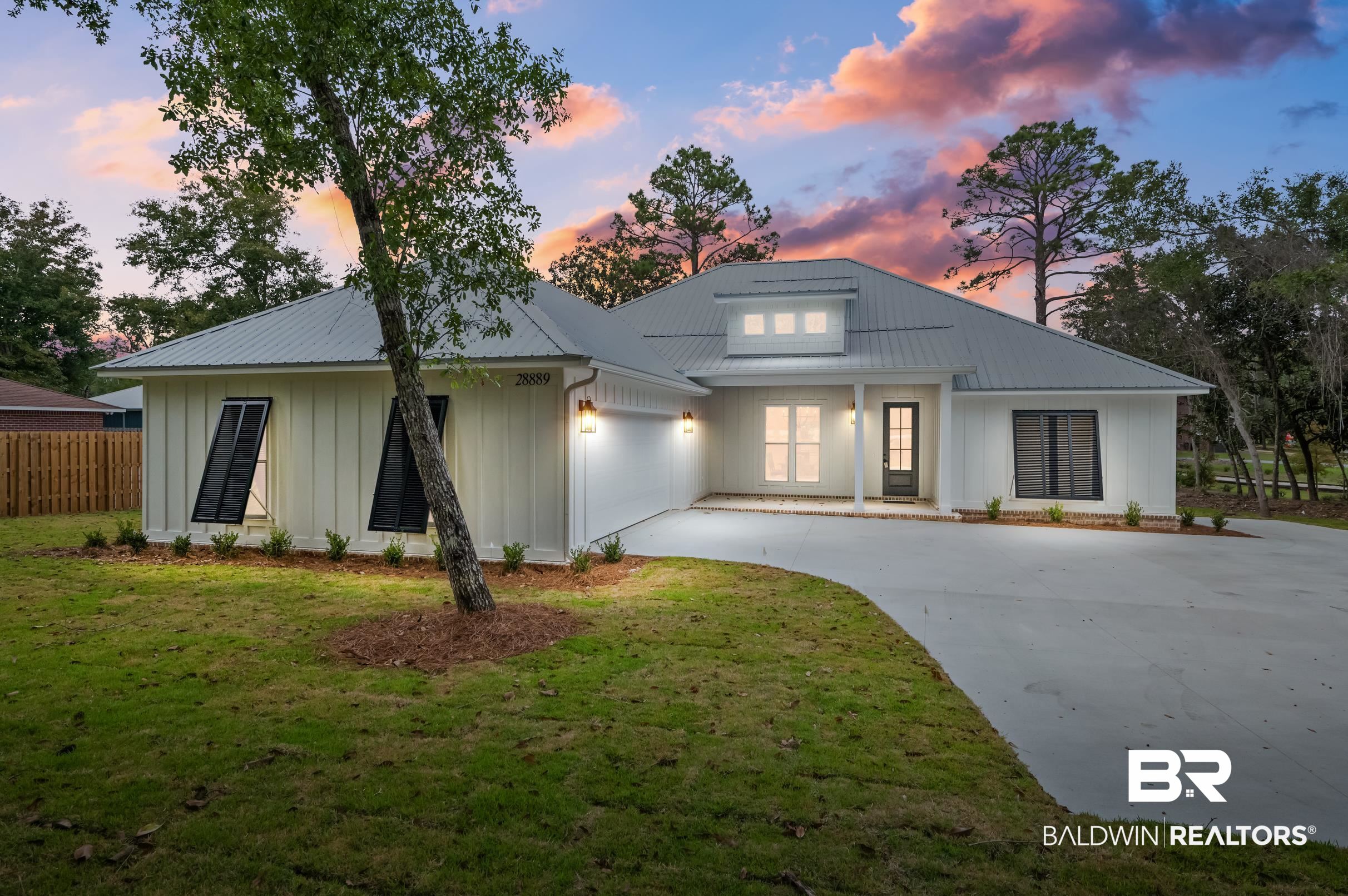 28889 Canal Road Orange Beach, AL 36561 - Photo 1 of 55 Modern inspired farmhouse with a yard and a garage