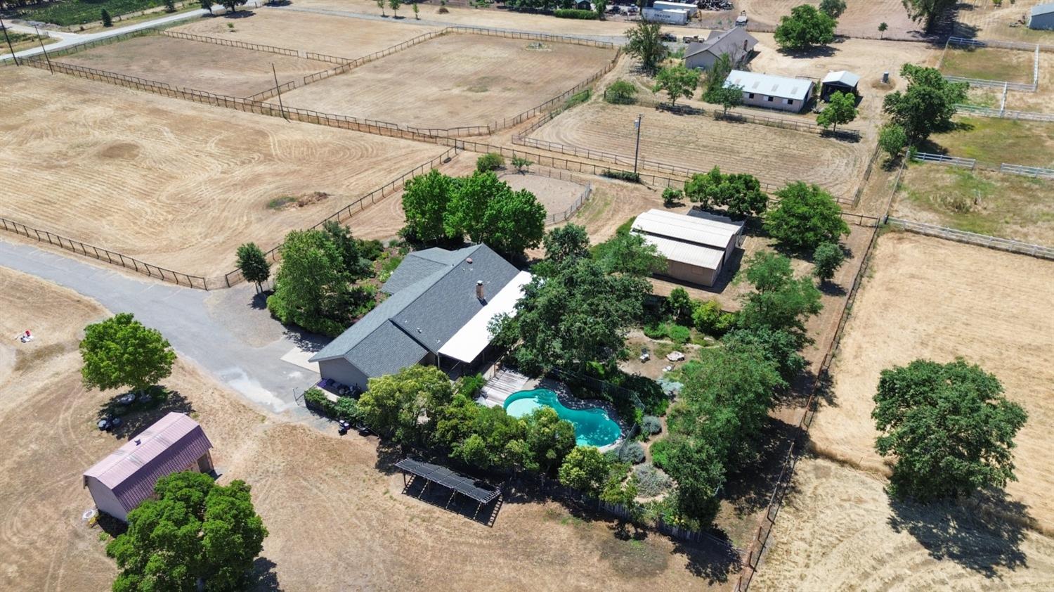 9408 Magos Road Wilton, CA 95693 - Photo 1 of 1 an aerial view of a house with a yard