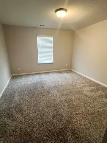 an empty room with a windows