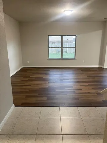 a view of an empty room with windows