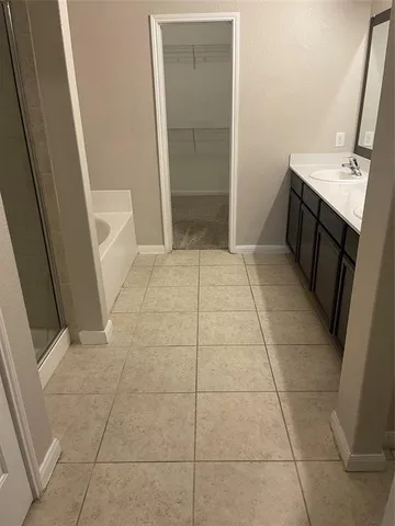 a bathroom with a sink a toilet and a shower