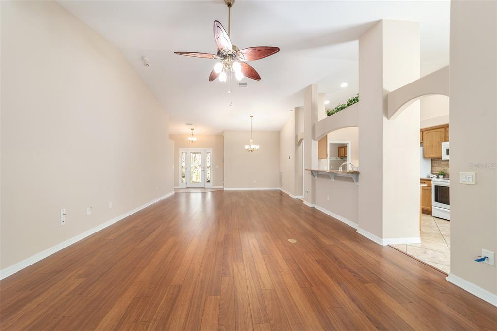 16369 Southwest 14th Avenue Road Ocala, FL 34473 - Photo 13 of 49 a view of a kitchen and a kitchen with wooden floor